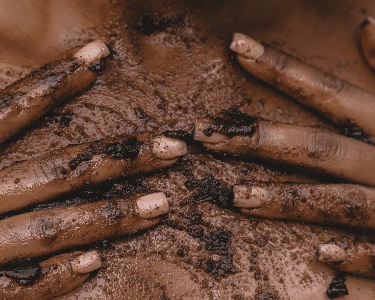 Brown Skin with herb infused body scrub massaged in to the skin